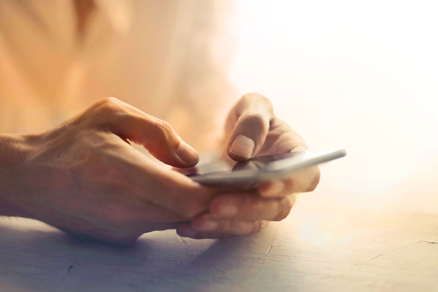 Hands holding a smartphone